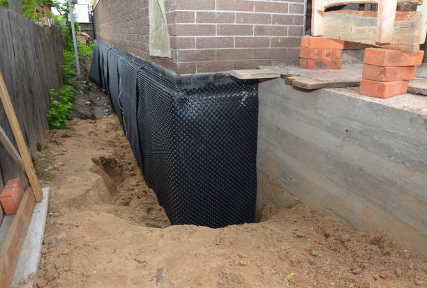 Happy homeowners after waterproofing job in Hatley
